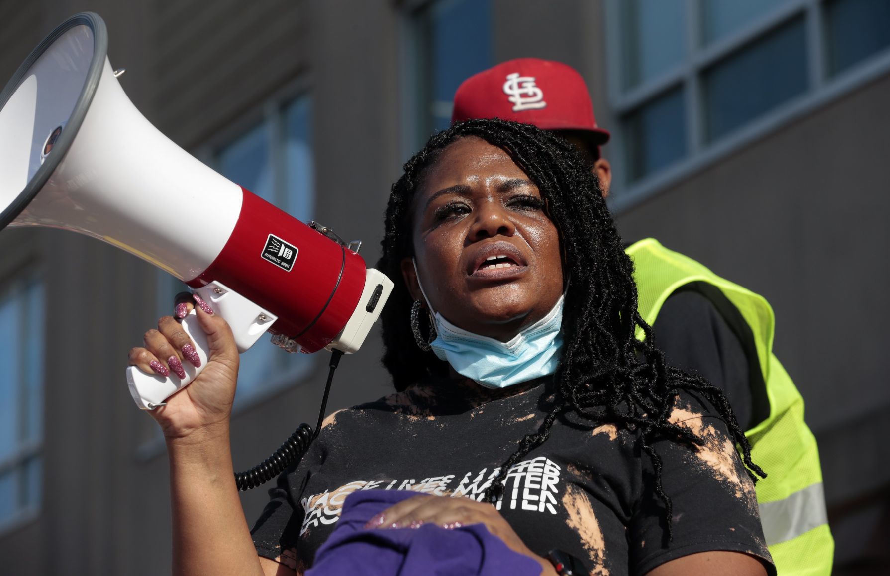 Protesters march through the Delmar Loop